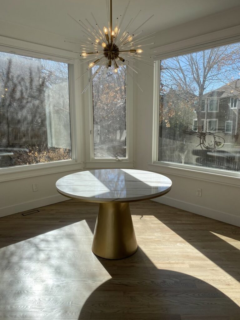 A modern sputnik chandelier installed in a dining area by All Electric llc in Denver, CO