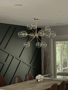 Modern sputnik-style chandelier installed in a dining room by Armenergo Electrician in Rockville, MD