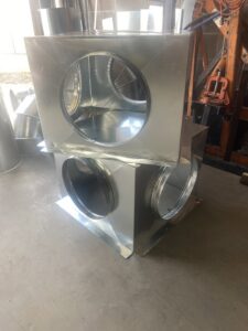 Stacked galvanized steel ductwork components for an HVAC system from Butte Heating & Cooling in Rapid City, SD.
