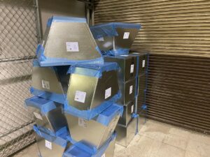 Neatly stacked new HVAC ductwork components ready for transport and installation by HVAC Solutions in Colorado Springs, CO