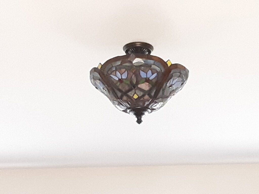 A decorative stained glass flush mount light fixture installed by C. C. Taylor Electric LLC in Powhatan, VA.