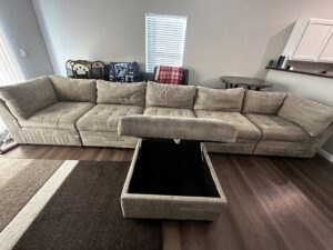 A stained sofa cushion requiring upholstery cleaning by Alpha Clean, a carpet contractor in Fort Wayne, IN.