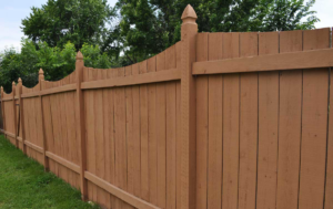 A long, stained wood privacy fence installed by Prattville Fence Contractor in Prattville, AL, providing property enclosure.