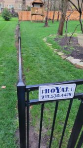 A newly installed and stained wood privacy fence by Royal Fence & Design LLC in Olathe, KS.