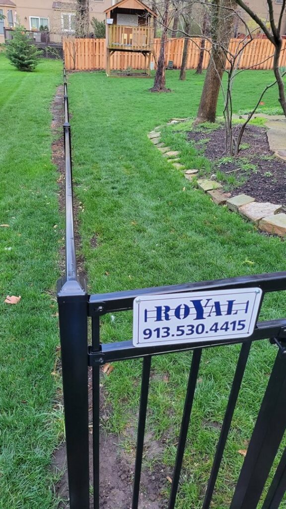 A newly installed and stained wood privacy fence by Royal Fence & Design LLC in Olathe, KS.