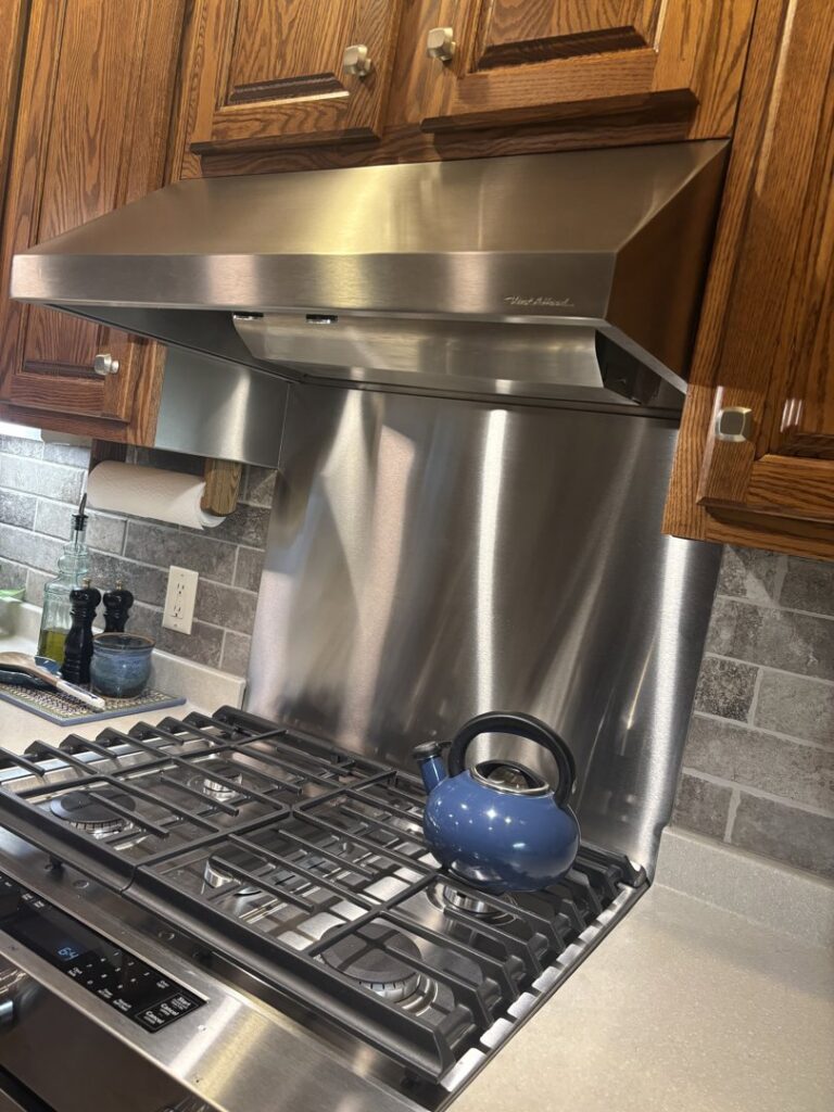 Stainless steel kitchen range hood installation by Sheet Metal Solutions, LLC in Duluth, MN.