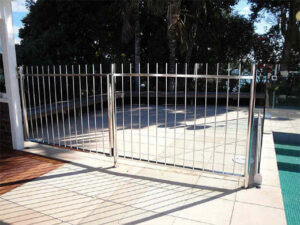 A stainless steel pool fence and gate installed by Stewart & Son Gate & Fence Co. in Hillsboro, OR