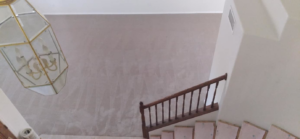 Overhead view of a staircase and landing area with new carpet installed by Magick Flooring Installs in Phoenix, AZ