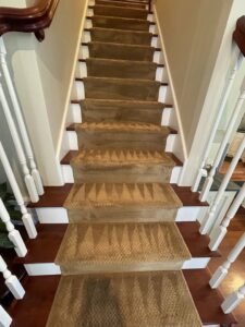 Cleaned carpeted staircase showing fresh cleaning lines by Tmz Magic Carpet Cleaning in West Hartford, CT.
