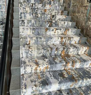 A beautifully finished staircase with installed carpet by Craftmark Installations LLC in Broken Arrow, OK