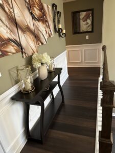 A modern staircase featuring new gray carpet tread installation by HM Bates Flooring & Remodeling in Matthews, NC.