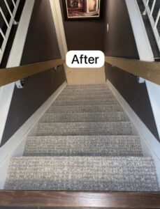 An 'After' photo of a staircase with new grey carpet installed by The Flooring Supplies Co. in Livonia, MI.