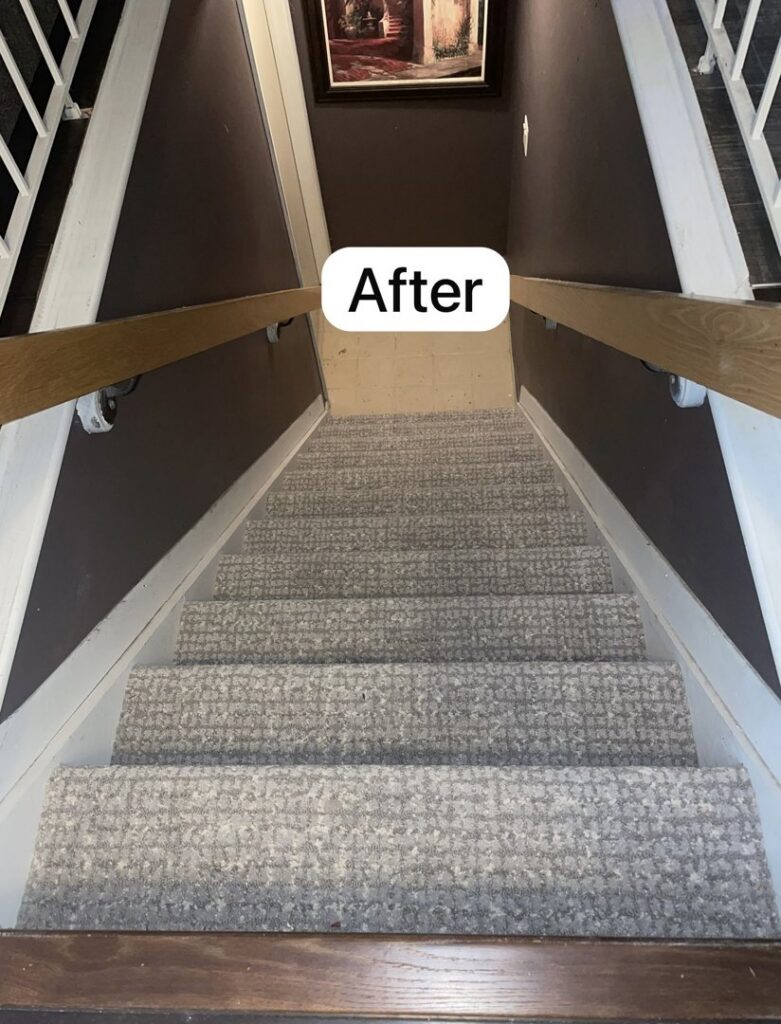 An 'After' photo of a staircase with new grey carpet installed by The Flooring Supplies Co. in Livonia, MI.