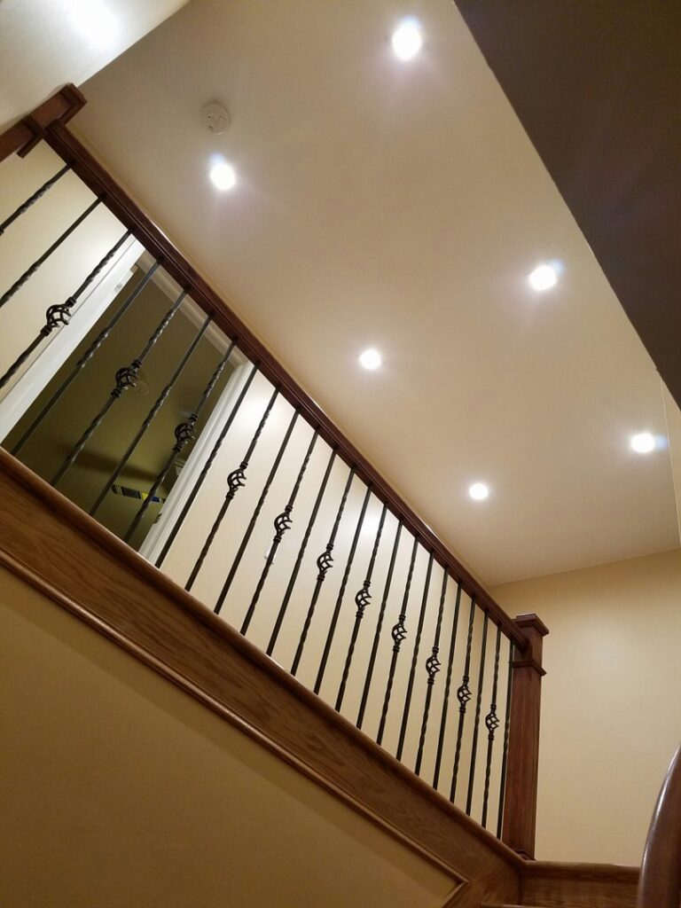 Recessed lighting installed above a staircase, providing illumination by MDEC Electrical & Lighting in Livonia, MI.