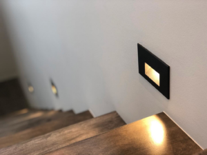 Modern step lighting installed along a staircase by Obot Electric in Bellevue, WA