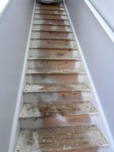 Stairs after old carpet removal, showing the subfloor, by J&A Flooring Masters Corp. in Joliet, IL.