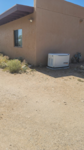 A Generac standby generator professionally installed next to a home by Energysense llc in Tucson, AZ.