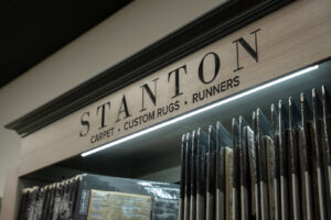 A display of Stanton carpet, custom rugs, and runners at Grain Design Flooring in Florence, KY.