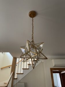 A decorative star-shaped pendant light fixture installed by Flavin Electric, LLC in Chicago, IL