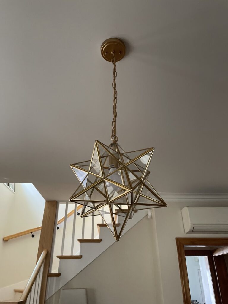 A decorative star-shaped pendant light fixture installed by Flavin Electric, LLC in Chicago, IL