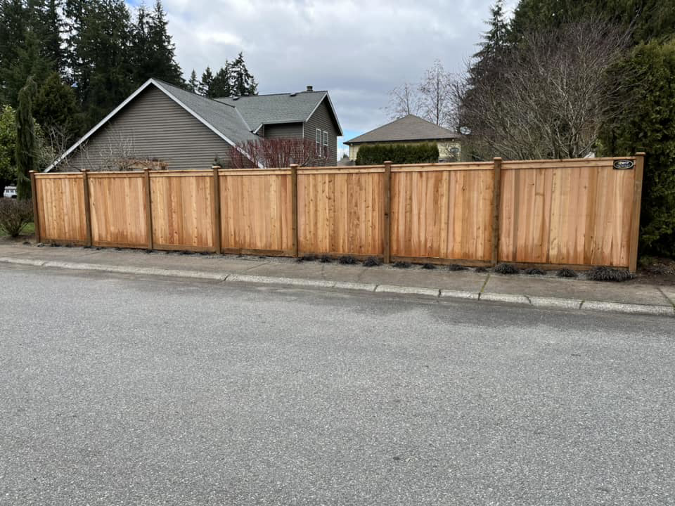 A new wood privacy fence installed along a street by Webb Fencing Pros in Seattle, WA.