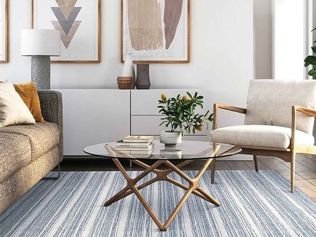 A modern striped area rug enhancing a living room space, offered by Morency Flooring in New Bedford, MA.
