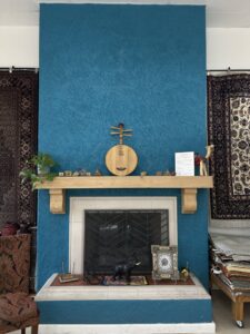 A striped area rug with detailed close-ups, available at Ebie's Rug Cache & Ebie's Rug Cleaning in Tucson, AZ