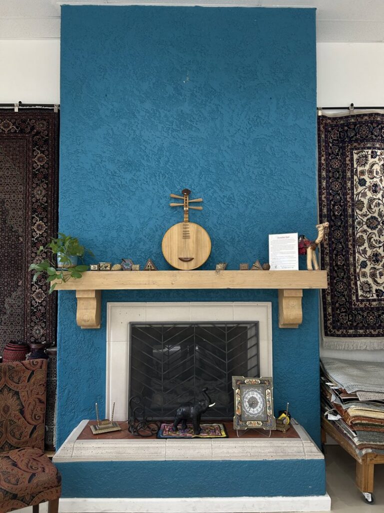 A striped area rug with detailed close-ups, available at Ebie's Rug Cache & Ebie's Rug Cleaning in Tucson, AZ