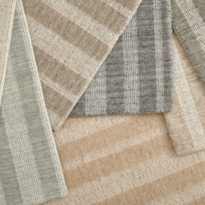 Various striped carpet and rug samples in neutral colors, offered by Artifacts Fine Rugs and Flooring in South Salt Lake, UT.
