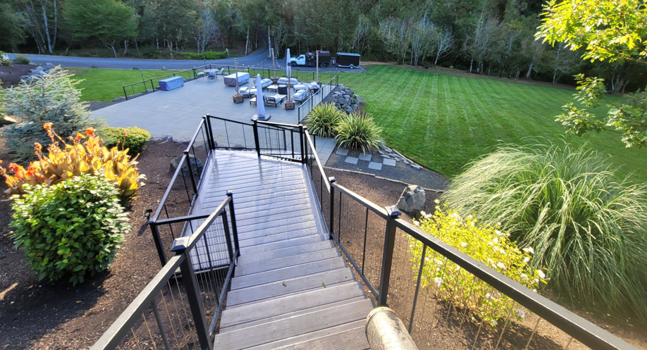 A beautifully striped and maintained lawn, showcasing professional lawn care by OregonScapes in Eugene, OR.