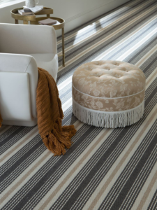 A stylish room featuring a newly installed striped wall-to-wall carpet by David Tiftickjian & Sons in Buffalo, NY