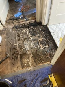 Subfloor preparation with debris and tools during a carpet installation project by LL Flooring in San Antonio, TX