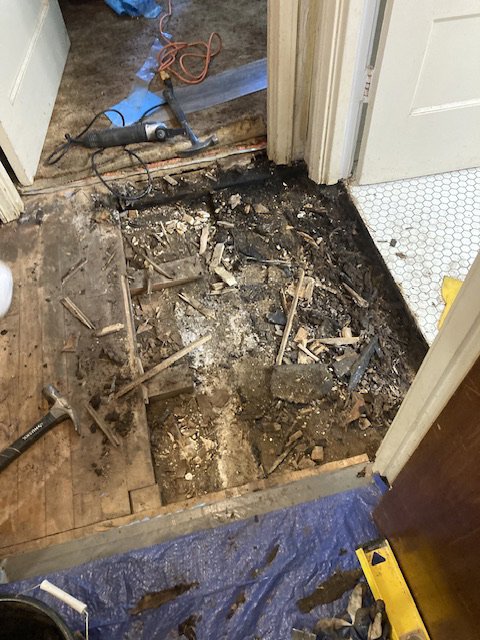 Subfloor preparation with debris and tools during a carpet installation project by LL Flooring in San Antonio, TX