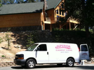 A Superior Carpet Care branded van parked outside a residential home, ready for a job in Fresno, CA.