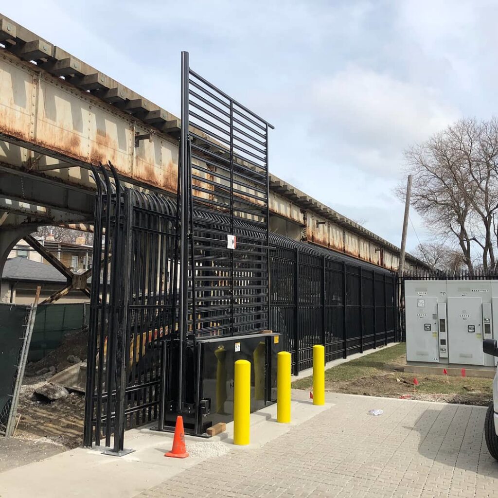 Tall black security fence and gate system installed by Gate Options in West Chicago, IL