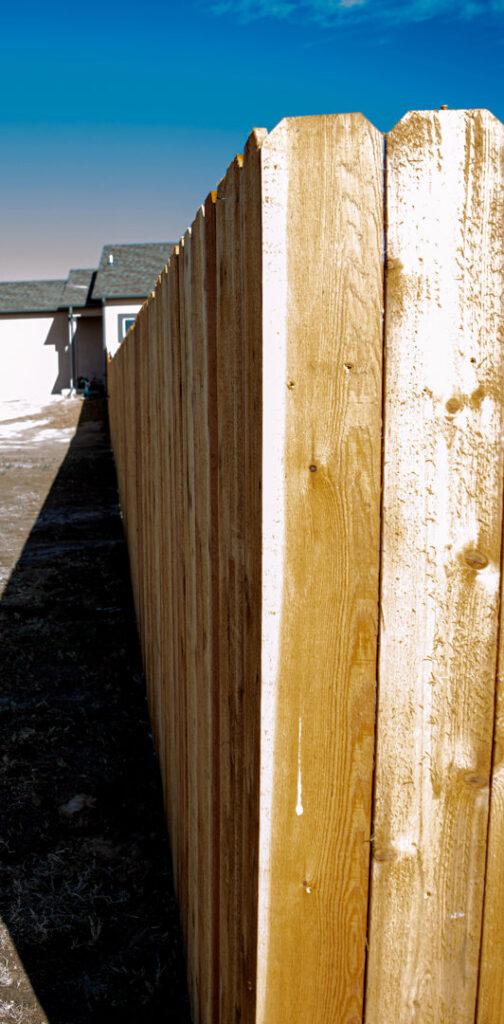 A tall wood privacy fence installed by Fence Tech in Everett, WA, providing seclusion for a property.