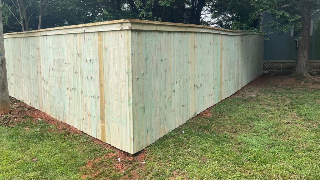 A tall, sturdy wood privacy fence providing security and seclusion by Superior Fence & Rail of Charlotte, NC