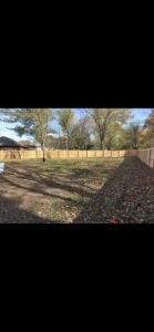 A tall wooden privacy fence installed in a residential backyard by Fenceworks of Middle Tennessee in Nashville, TN.