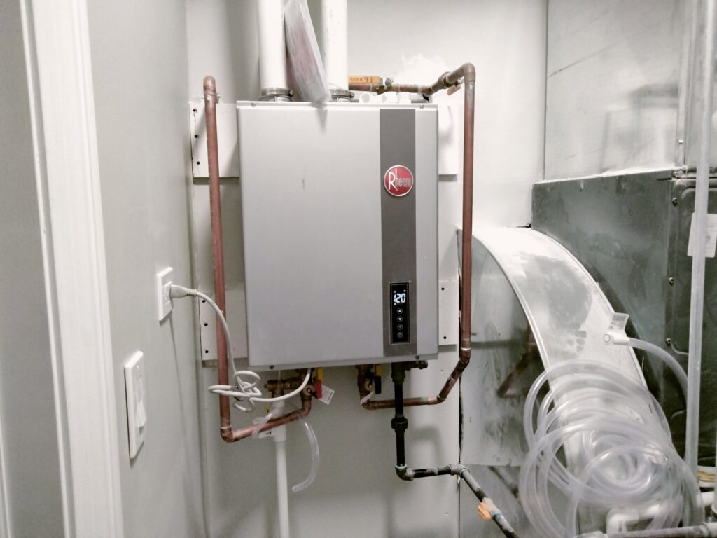 A newly installed tankless water heater with copper piping by Bean'z Heating and Cooling in Chicago, IL.