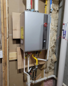 A Rheem tankless water heater professionally installed by ESR Heating, Cooling and Refrigeration in Raymore, MO.