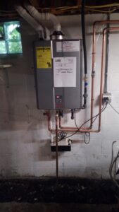 A tankless water heater installation with copper piping by Falso Service Experts in East Syracuse, NY.