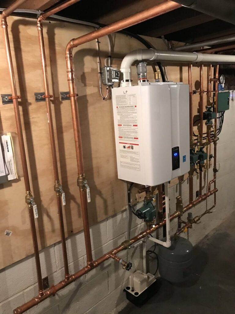 A newly installed tankless water heater with copper piping by Hawn Heating and Air Conditioning in Rochester, NY.