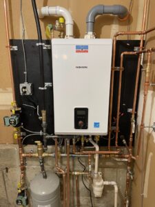 A new tankless water heater installation with copper piping by MAC Heating and Cooling LLC in Waterbury, CT.