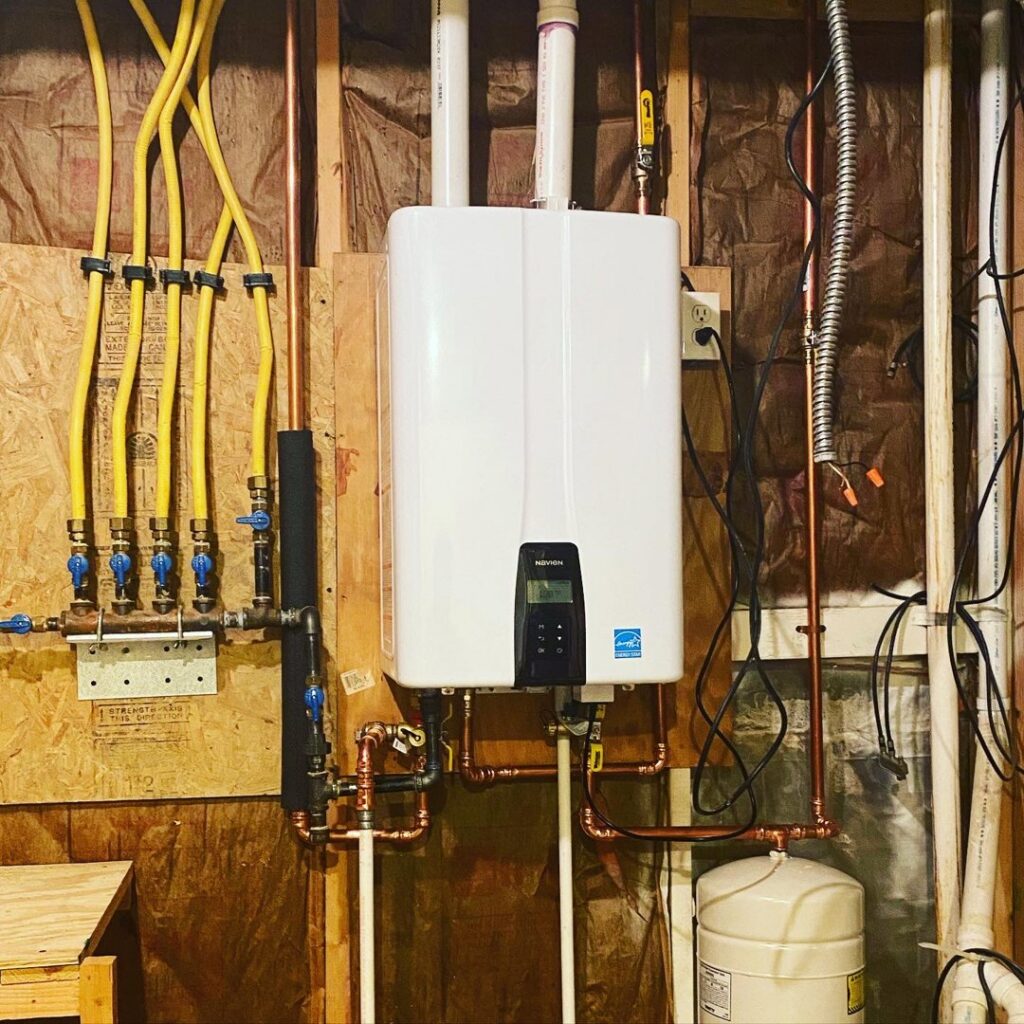 A new tankless water heater installation with copper and gas lines by My HVAC Guy in North Canton, OH.