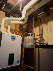 A tankless water heater and associated piping installed by Nimmer Heating & Air Conditioning in Milwaukee, WI.