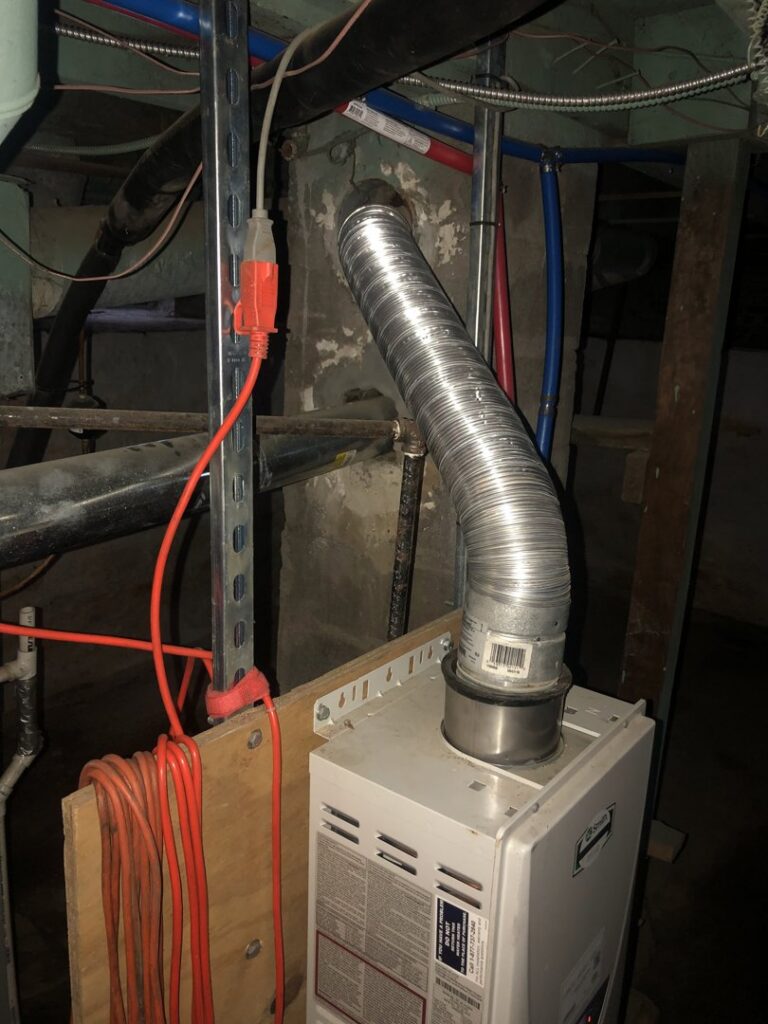 A tankless water heater with flexible exhaust ducting installed by Ohio City Heating and Cooling in Cleveland, OH.