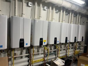 Multiple tankless water heaters installed with new piping by R.J. O'Neil Inc. in Montgomery, IL.