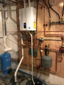 A professional tankless water heater installation with copper piping by The Heating Guys in Fargo, ND.