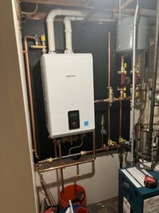 A tankless water heater system with copper piping installed by Quality Comfort Inc. in Aston, PA