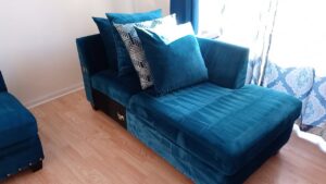A teal chaise lounge showing fresh cleaning marks after professional upholstery service by Steam Choice Carpet Care Inc in Chicago, IL.